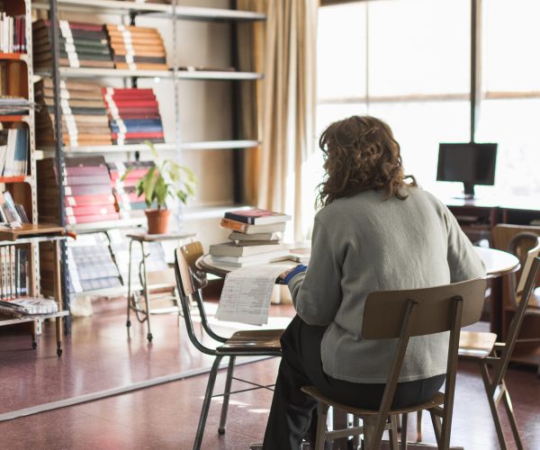 anonymous-woman-working-library