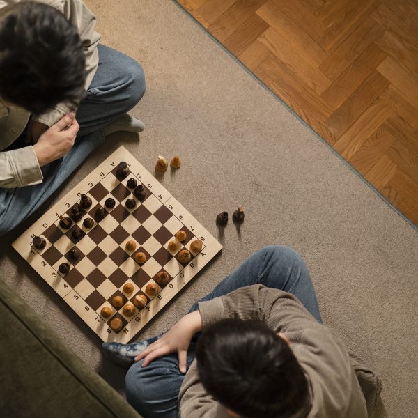 close-up-father-boy-playing-chess