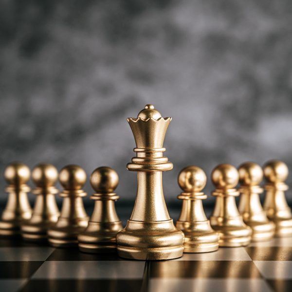 Gold Chess on chess board game for business metaphor leadership concept